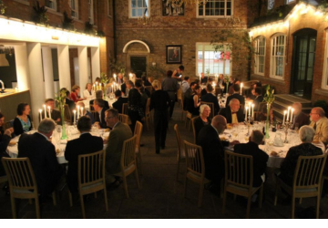 Guests dining by candlelight in the Cassidy Quad